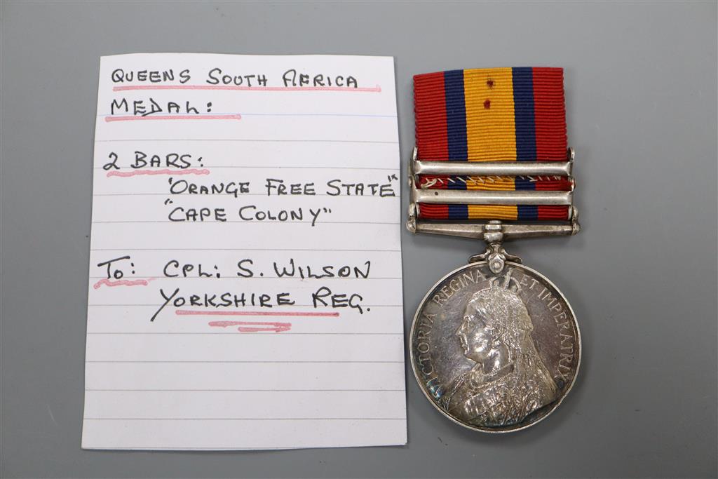 A Queens South Africa medal with 2 clasps to Cpl. S.Wilson, Yorks Regt.